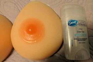 a size comparison photo of the forms beside a short stick of deodorant